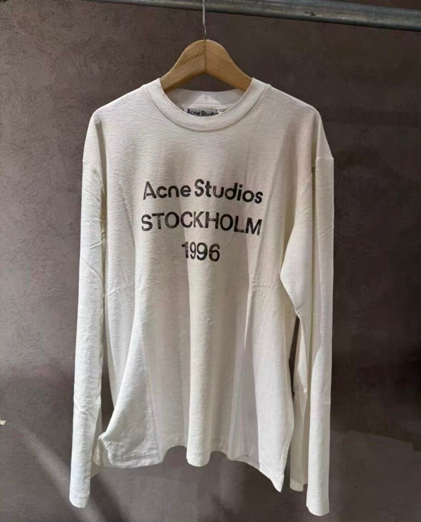 Acne Studios retro distressed 1996 lettered print loose off-the-shoulder long-sleeved shirt